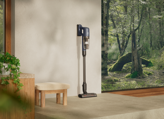 Cordless vacuum cleaner in room next to a window